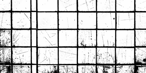 Abstract white brick wall with black grout lines shows a cracked and aged texture, and tear on the surface of the brick pattern	