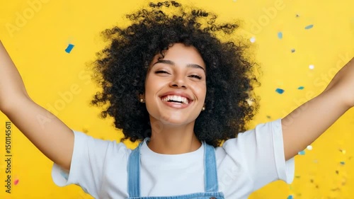 A woman is smiling and jumping in the air with confetti falling around her. Concept of joy and celebration