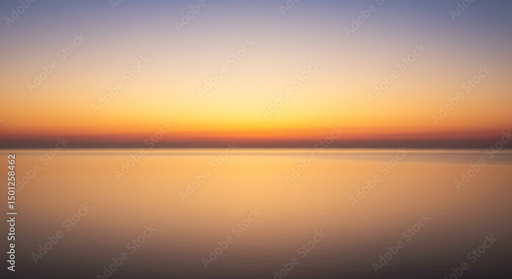 Obraz premium Serene Sunset Over Calm Ocean Water