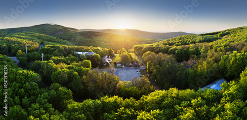 Aerial shot of green hills of Slovakia at sunrise, Pezinska Baba