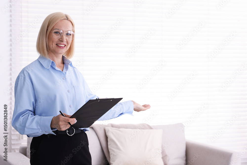 Professional psychologist with clipboard in office, space for text Professional psychologist with clipboard in office, space for text