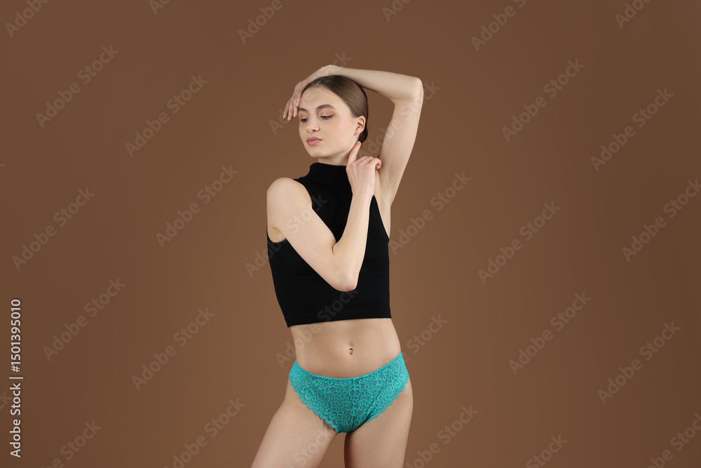 Obraz premium Woman wearing beautiful underwear on brown background