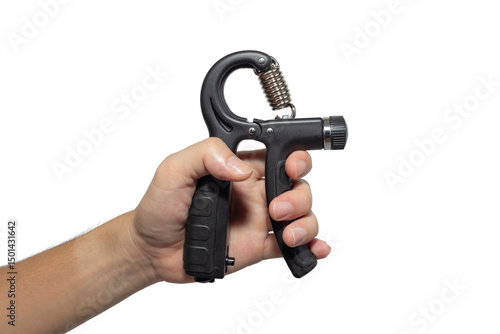 Foto A hand firmly grips a black adjustable hand gripper against a stark white background, showcasing strength training equipment