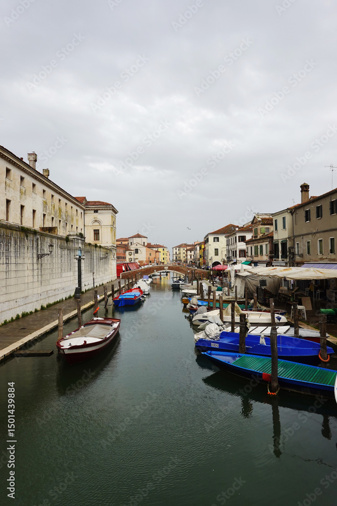 Fototapeta premium Old canals and streets in Chioggia, Italy