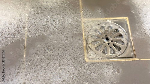 Stainless steel drain grate in the bathroom