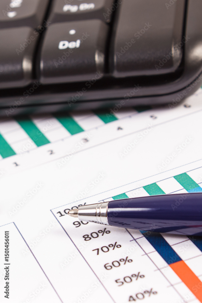 Ballpen, computer keyboard and financial chart showing production or sales statistics. Business Ballpen, computer keyboard and financial chart showing production or sales statistics. Business
