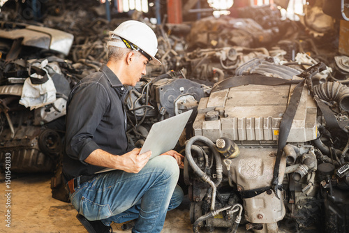 Fotografie adult senior technician engineer finding used car engine block order from custom