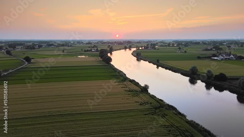 Golden Hour Illuminates River Bends And Rural Farmlands From Above
