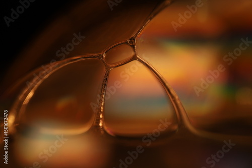 Oil production, bubbles in macro, texture of viscous black liquid, oil in laboratory	