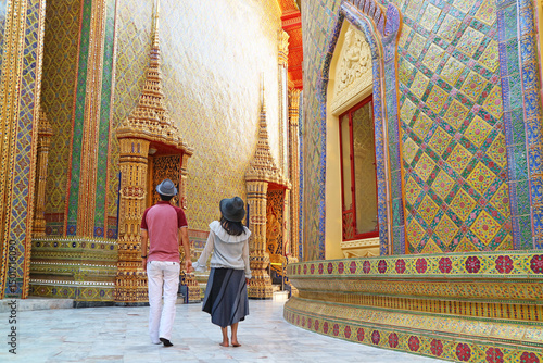 Couple Walking Along the Amazing Circular Corridor at the Pagoda's Base in Wat Ratchabophit Buddhist Temple, Bangkok, Thailand