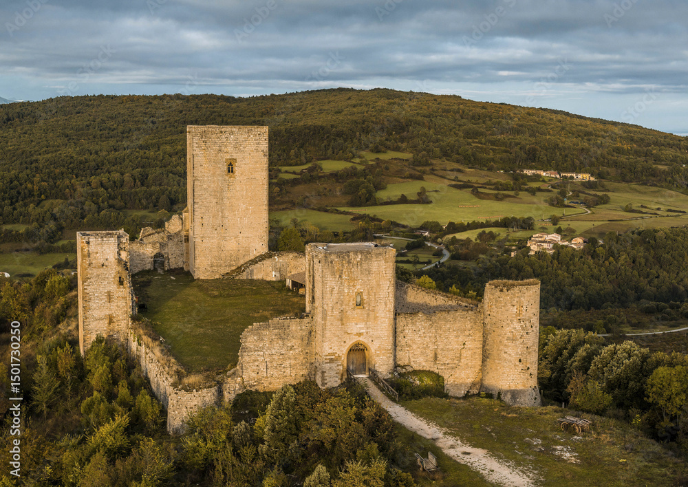 Aerial view of puivert castle surrounded by scenic hills and lush forest, Aude, France. Aerial view of puivert castle surrounded by scenic hills and lush forest, Aude, France.