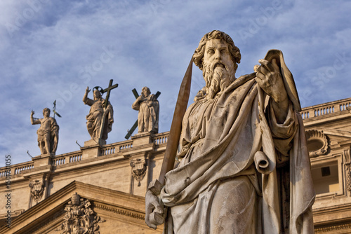 Aerial view of the ornate facade of St. Peter's Basilica with the statue of Saint Paul and apostles, Vatican, Rome, Italy.