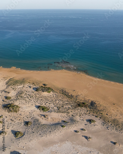 Wallpaper Mural Aerial view of beautiful sandy beach with tranquil waves and azure coastline, Rizokarpaso, Famagusta, Turkish Republic of Northern Cyprus. Torontodigital.ca