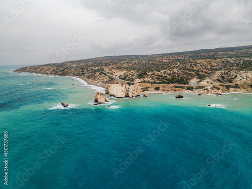 Aerial view of beautiful Aphrodite Beach with serene rock formations and azure sea, Kouklia, Paphos, Cyprus.