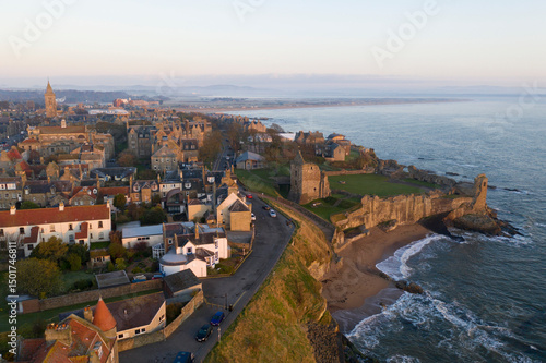 Aerial view of St Andrews Castle and university along the beautiful coastline with cliffs and beach, St Andrews, Fife, Scotland.