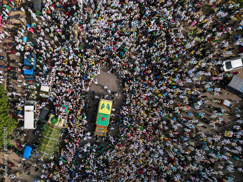 Chittagong, Bangladesh - 09 October 2022: Aerial view of a vibrant and colorful festival with a large crowd celebrating in the streets, Chittagong Kotwali Thana, Bangladesh. photo
