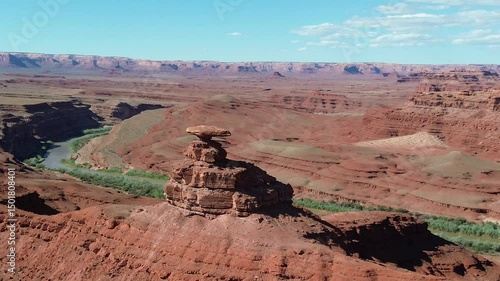 Mexican Hat rock formation in southern Utah. Rotating pan shot that shows the formation, the river below, and Valley of the Gods in the background