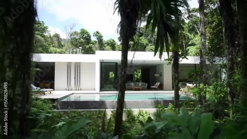 Serene Modern Villa With Swimming Pool Embraced By Lush Tropical Scenery