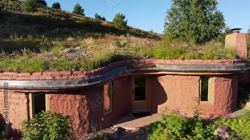 Organic Architecture Cob House With A Living Roof And Greenery Surroundings