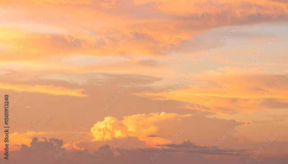 Fototapeta premium Orange Pink Sunset Sky with Soft Clouds