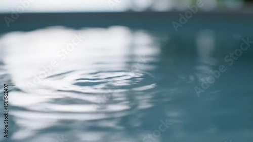 Water ripple surface liquid motion blue background abstract nature calm aqua pool raindrop texture