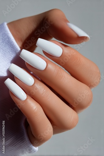 Elegant White Nail Polish on Manicured Hand With Soft Fabric Background