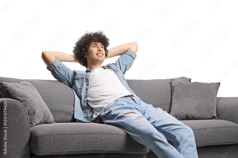 Happy young man relaxing on a sofa Happy young man relaxing on a sofa