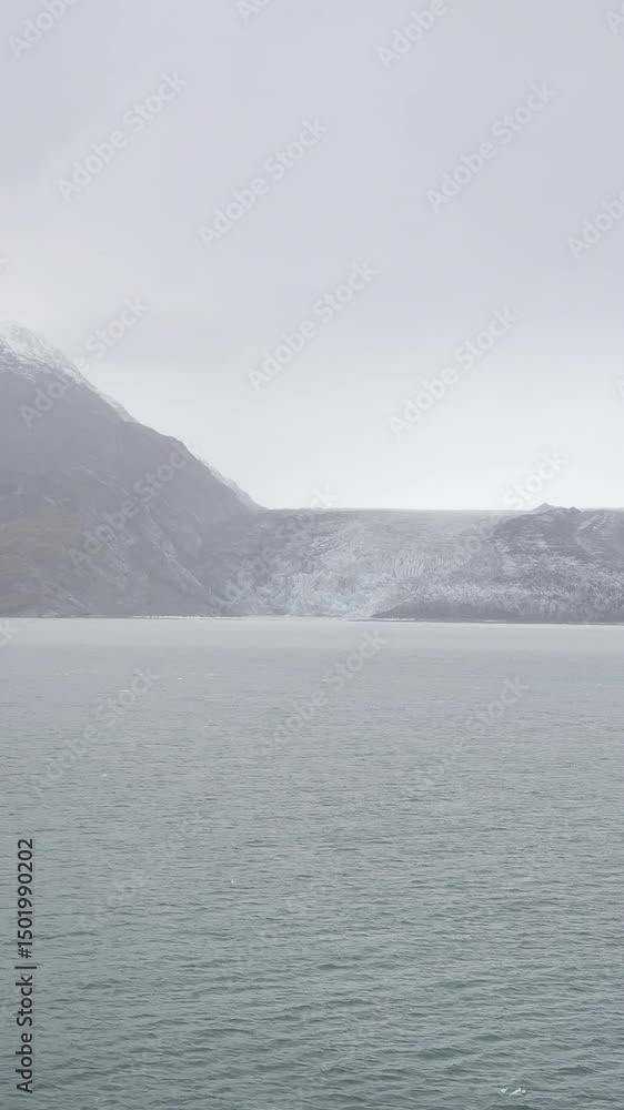 13 October 2024 - USA, Alaska, Glacier Bay National Park and Preserve, Johns Hopkins Inlet, Lamplugh - Harsh beauty cruise ship approaching terminus in rain 13 October 2024 - USA, Alaska, Glacier Bay National Park and Preserve, Johns Hopkins Inlet, Lamplugh - Harsh beauty cruise ship approaching terminus in rain