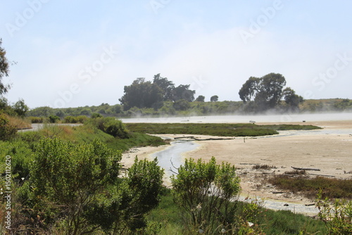 Lake with steam coming off of it