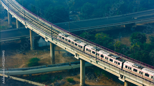 Cuadro en lienzo Top down view of The Delhi Metro is running on the tracks towards the Blue Line and Pink Line
