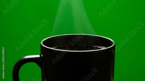 A scene of coffee enjoyment, evoking cozy atmosphere, mug, steam, hot beverage, Steaming cup, warm cup of coffee with a captivating steam rises from the dark coffee, a green background. 
