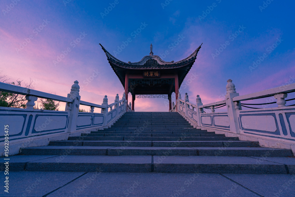 Fototapeta premium Ancient Chinese Pavilion on a Bridge at Sunrise