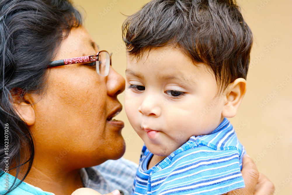 Tender portrait of indigenous South American woman with her little son. Tender portrait of indigenous South American woman with her little son.