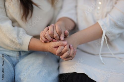 happy love images Asian family Mother and daughter hold hands and encourage each other.