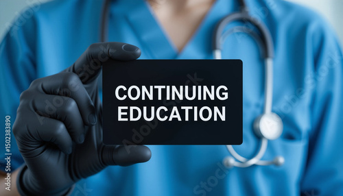 Physician holding black paper card with inscription CONTINUING EDUCATION. Continuing education and personal development medicine concepts