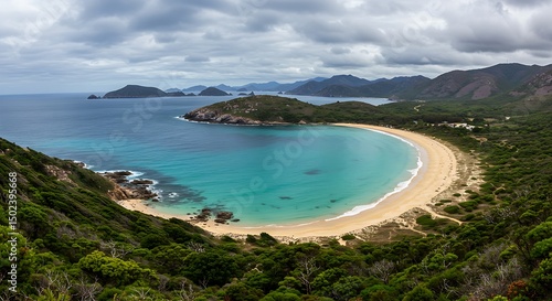 Scenic Australian vista of Wineglass Bay, showcasing its natural beauty under a dramatic sky.