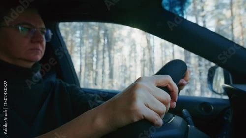 Wallpaper Mural A focused and attentive driver firmly grips the steering wheel while expertly navigating through a beautifully scenic forest road, showcasing the serene and peaceful beauty of nature all around them Torontodigital.ca