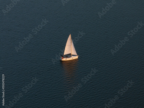 Aerial View of Sailboat on Calm Water