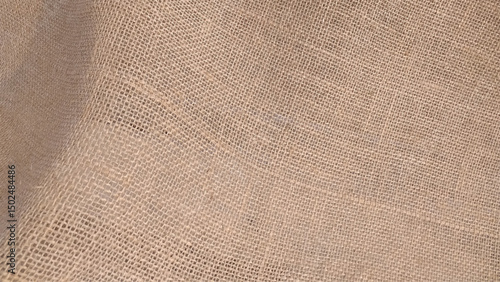 Close-up of fabric woven from burlap. sackcloth bagging textured background closeup