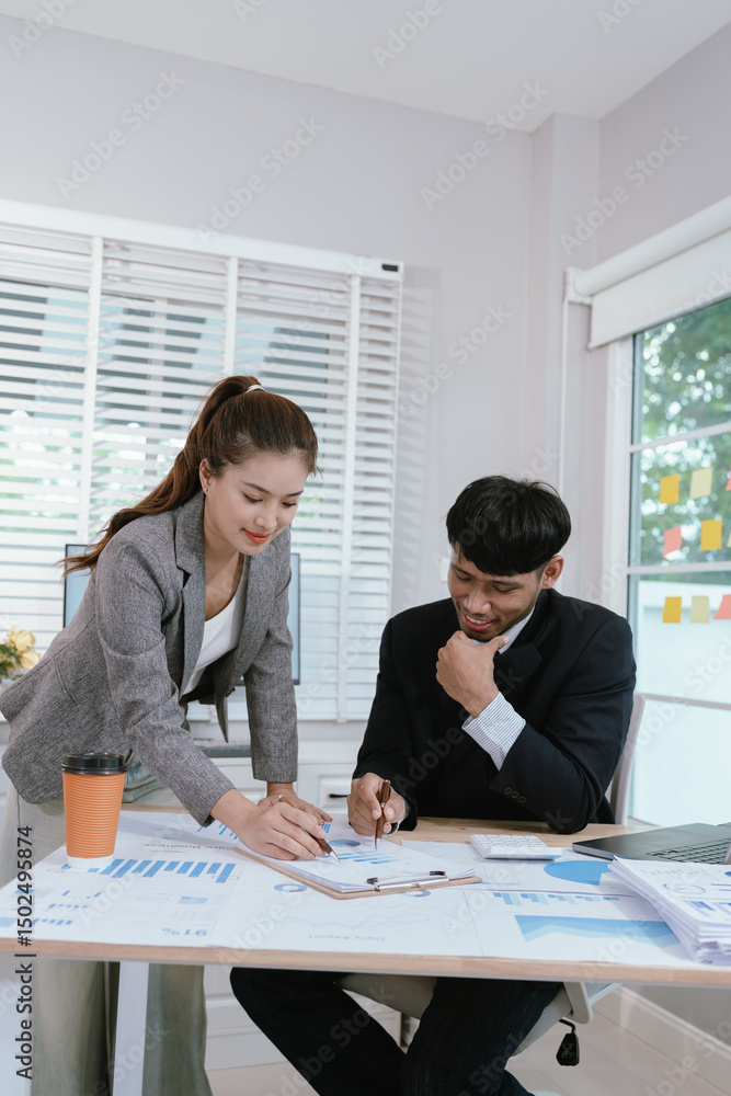 custom made wallpaper toronto digitalBusiness professionals analyzing investment graphs and financial charts on laptops during a strategic meeting in a modern office environment.