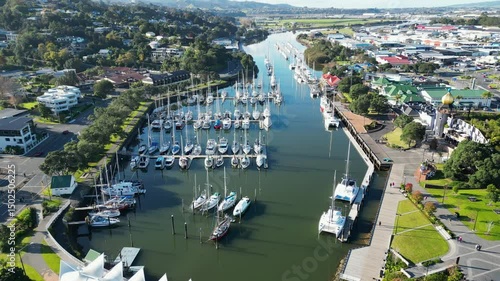 Drone view of scenic marina (Town Basin) with sailboats, paths and cafes in Whangarei, New Zealand.