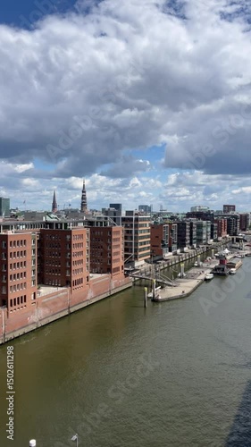 Hamburg, Germany - April 20, 2025: Hafen City Street Towards the Elbe Philharmonic Hall. Traditionsschiffhafen in Hafencity. Old Town, Town houses. Modern residential, office building. Vertical video