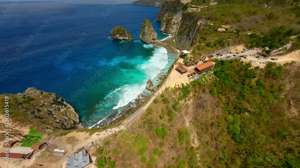 Dynamic FPV drone flight over dramatic cliffs and turquoise waters of Diamond Beach on Nusa Penida Island, Bali, Indonesia. Captures the natural beauty of limestone formations and ocean waves. Dynamic FPV drone flight over dramatic cliffs and turquoise waters of Diamond Beach on Nusa Penida Island, Bali, Indonesia. Captures the natural beauty of limestone formations and ocean waves.