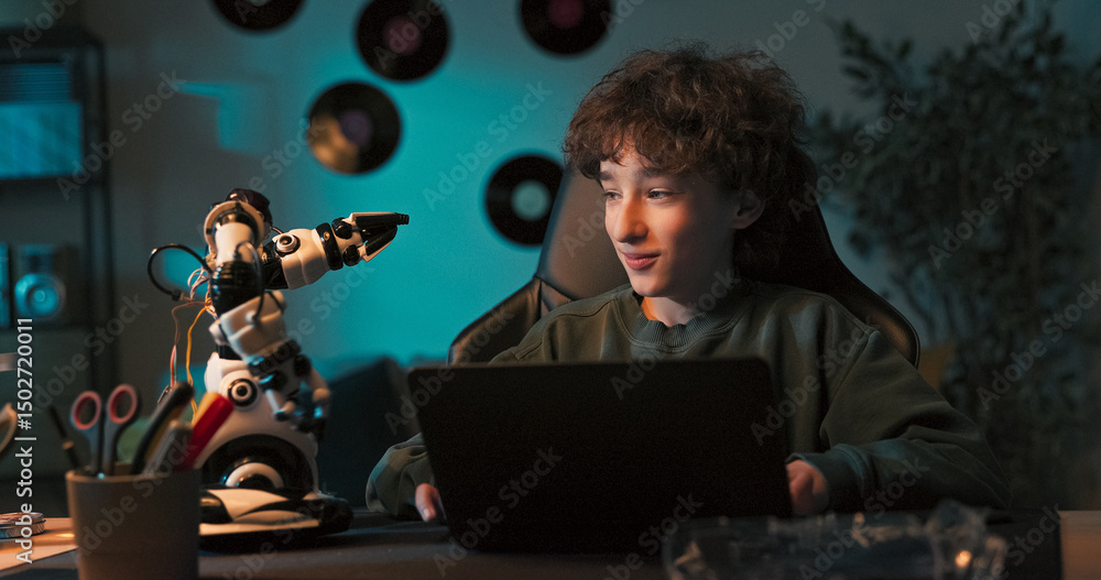 Fototapeta premium Sitting calmly on the floor, the child attaches robot pieces together. Each connection sparks more curiosity and strengthens his passion for how things work.