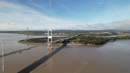 Wallpaper Mural /Bridge deck of highway bridge suspended on cables high above wide river. Vehicles driving on road. Aerial panoramic view. Severn Bridge, Wales, UK Torontodigital.ca
