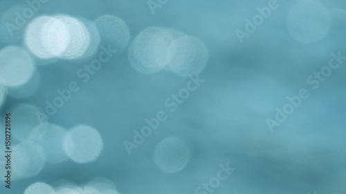 sun glare flickers on the water out of focus