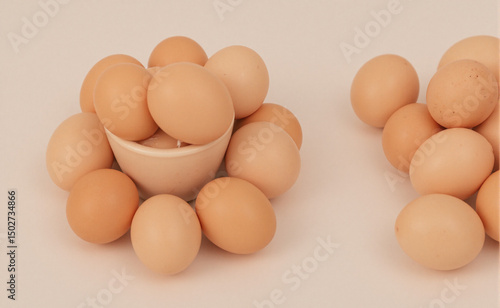Fresh brown eggs in a circular pattern on white, symbolizing simplicity and natural harmony.
