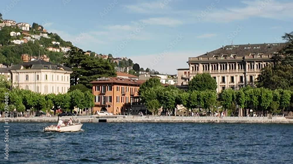 Como, Lombardy, Italy - May 15, 2025 - Tourists visit the city's historic center and the lake shores Como, Lombardy, Italy - May 15, 2025 - Tourists visit the city's historic center and the lake shores