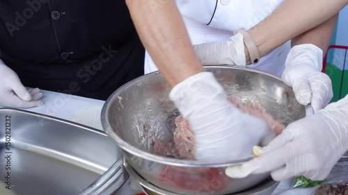 Close-up of Chef Mixing Ground Pork in Bowl During Food Preparation