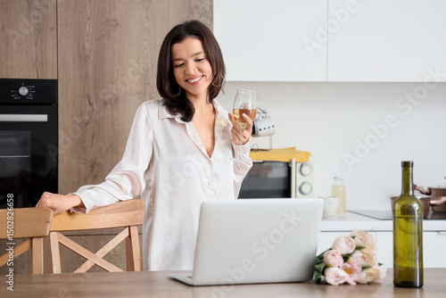 Young woman with wine havin...